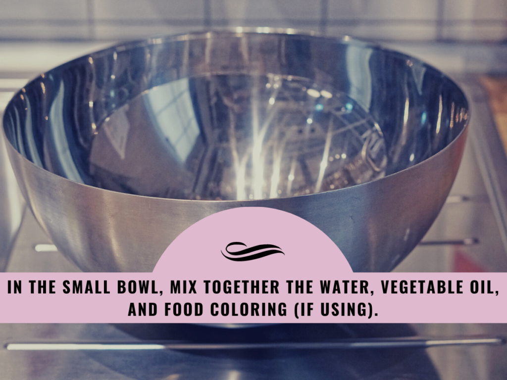 In the small bowl, mix together the water, vegetable oil, and food coloring (if using).